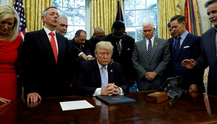 Faith leaders, led by Jeffress (second from left), gather with President Donald Trump to pray for those affected by Hurricane Harvey on Sept. 1, 2017.