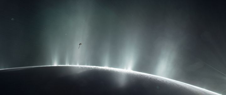 NASA's Cassini spacecraft is shown diving through the plume of Saturn's moon Enceladus, in 2015, in this photo illustration.