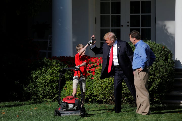 Frank gets a high five from Trump while Frank's dad, Greg Giaccio, watches.