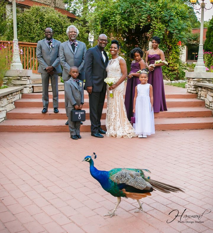 The wedding party included (from left to right): Denzel Goins (the bride’s son), Albert Conway (the groom's father and best man), Joshua Stoxstell (the bride's nephew and ring bearer), Emile and Tamatha Conway (the newlyweds), Kaitlyn Conway (the groom's daughter and junior bridesmaid), Akira Jarmon (the bride's niece and flower girl), and Tracey Jarmon (the bride's sister and maid of honor.)