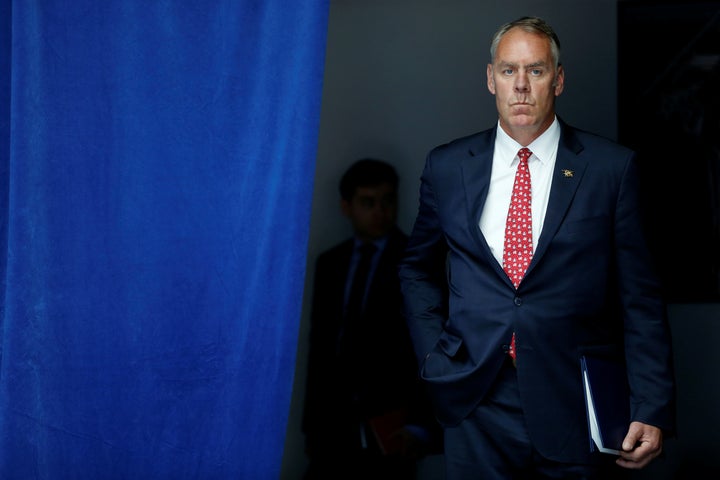 U.S. Interior Secretary Ryan Zinke waits to take the stage with President Trump for a speech on infrastructure in Washington, D.C., in June.