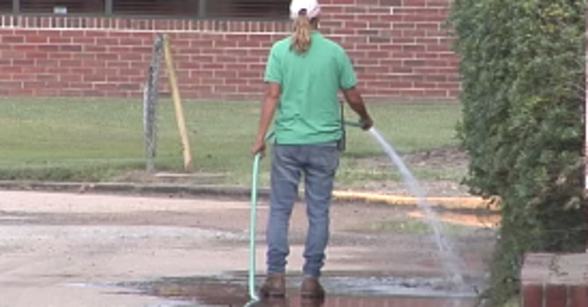 Blood Leaks Onto Road From Funeral Home Like A Scene From A Horror