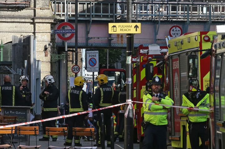 Members of the emergency services work outside Parsons Green tube following Friday's terror attack