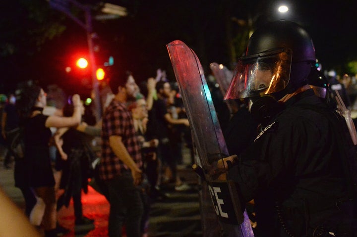 Law enforcement officers stand guard during a protest action following a not guilty verdict on September 15, 2017 in St. Loui