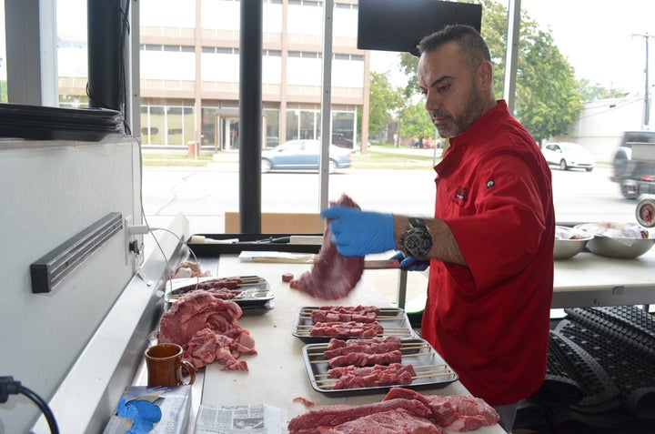 <p>Samer Saad, owner of “The Butcher’s Grille & Market” in Dearborn, Mich. plies his family trade of butchery for high-end customers in Dearborn’s Western downtown.</p>