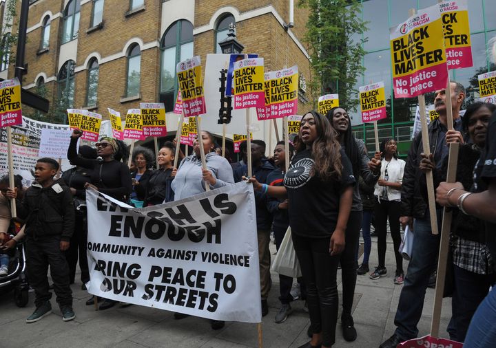 Members from Hackey Stand Up To Racism protest outside Stoke Newington Police Station