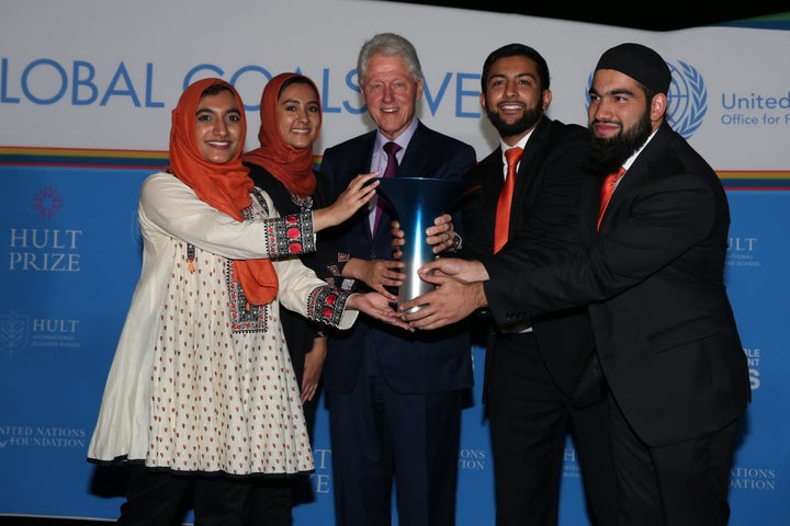 Former President Bill Clinton poses with the 2017 Hult Prize winners.