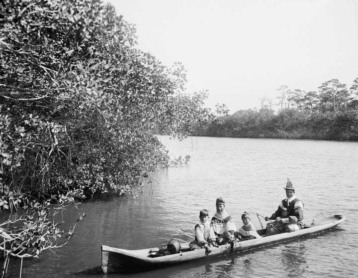 A photo taken in 1912 shows Seminole Indians in a dugout canoe on Florida's Miami River.