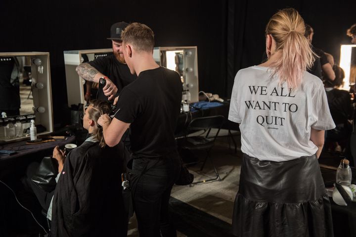 Models have their hair styled backstage before the start of the Topshop catwalk show for the Spring/Summer 2018 collection on the third day of London Fashion Week on 17 September 2017.