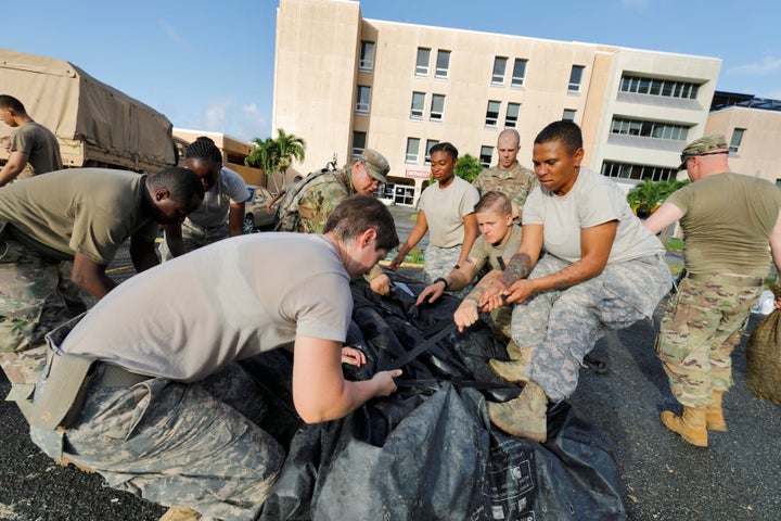 On the U.S. Virgin Islands on Sunday, soldiers from the 602nd Area Support Medical Company break down a field hospital outside the Schneider Regional Medical Center while preparing to evacuate in advance of Maria.