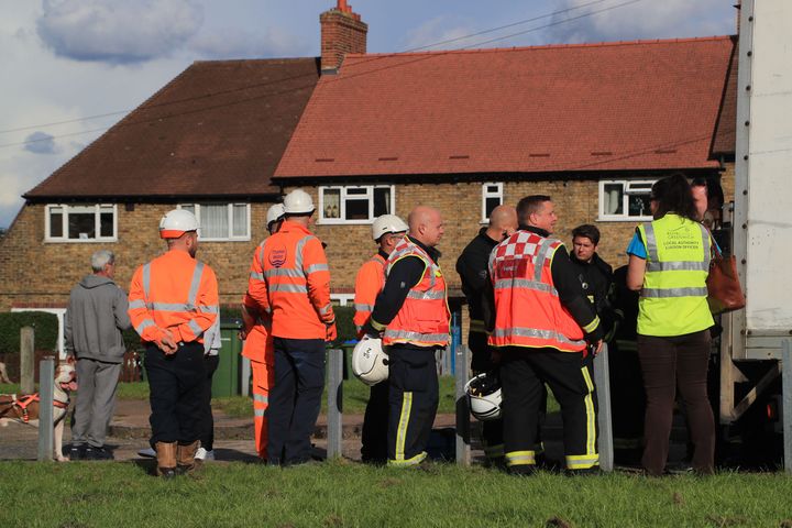 Emergency services personnel and staff from Thames Water and the local authority of Greenwich at Alwold Crescent in Lee, south London, where residents were rushed to hospital with nausea and vomiting amid fears of a chemical incident.