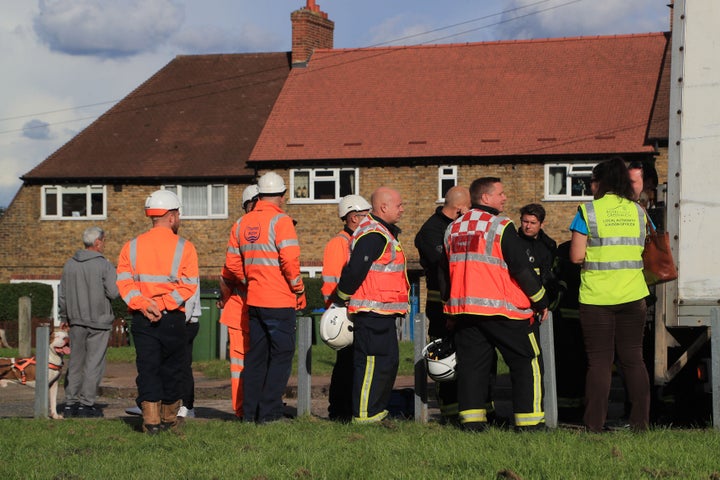 <strong>Emergency services personnel and staff from Thames Water and the local authority of Greenwich at Alwold Crescent in Lee, south London, where residents were rushed to hospital with nausea and vomiting amid fears of a chemical incident.</strong>