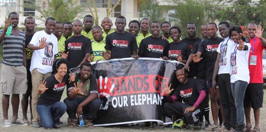 Dr. Kahumbu (front row left) and her team from the Hands Off Our Elephants campaign
