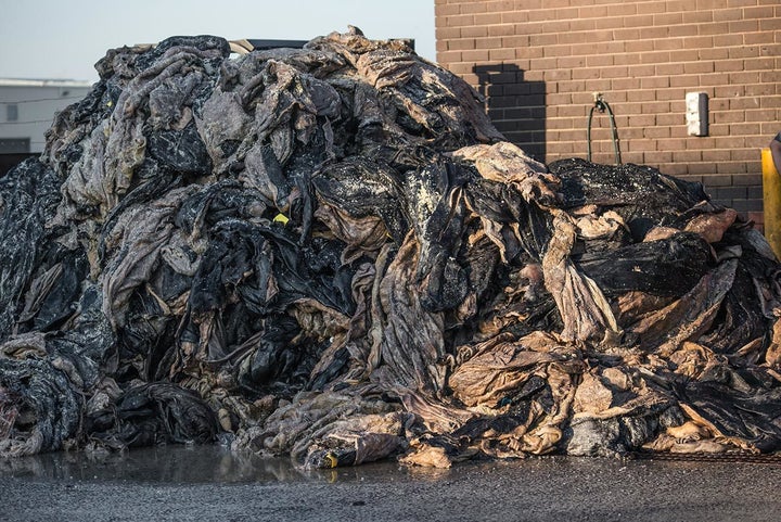 Huge stack of piled sheep and cow skins. Australia, 2017. Jo-Anne McArthur / We Animals.