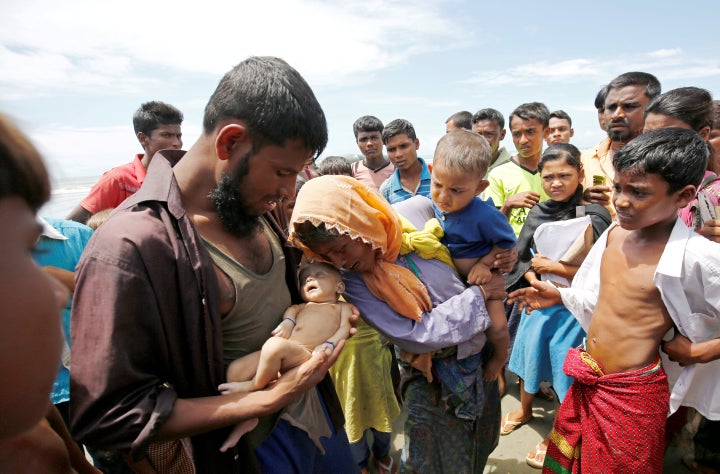 Nasir Ahmed cradles his dead son.