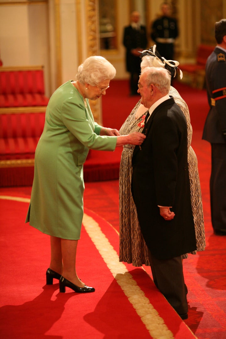 Penelope and Ronald Jones are made MBEs by Queen Elizabeth II at Buckingham Palace