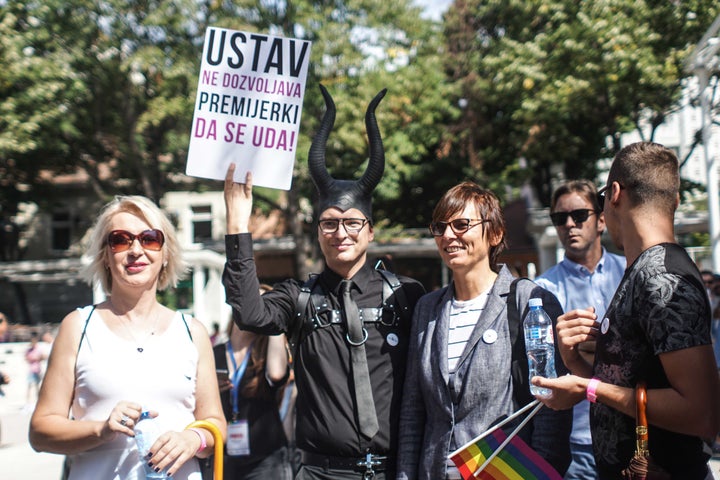 “The Constitution forbids the Prime Minister to get married” - activist Predrag Azdejkovic holding a banner as a reality check. On the left, Helena Vukovic, a transgender former Serbian Army officer