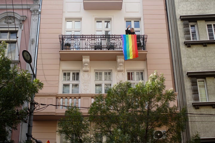 Some downtown residents stepped outside to say hi to Pride crowd