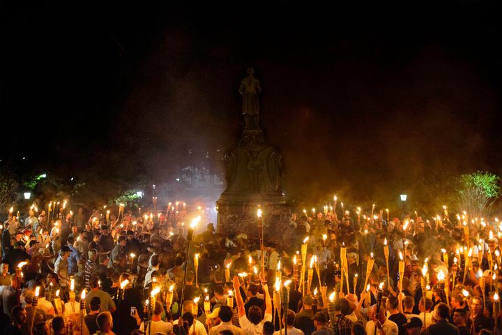 Neo Nazis, Alt-Right, and White Supremacists encircle counter protestors at the base of a statue of Thomas Jefferson after marching through the University of Virginia campus with torches in Charlottesville, Va., USA on August 11, 2017.