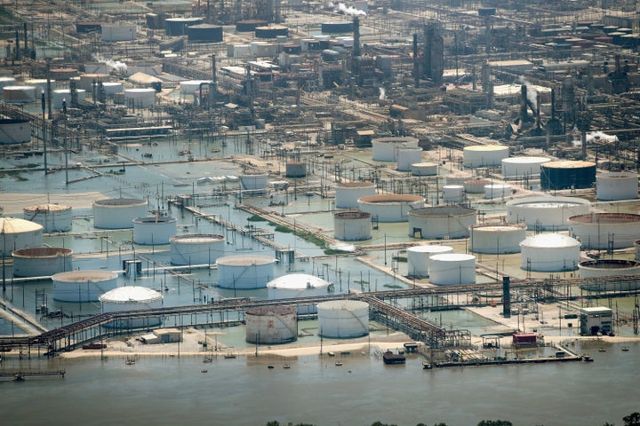 Floodwaters left in the wake of Hurricane Harvey begin to recede in an industrial area on Aug. 31, 2017, near Houston.