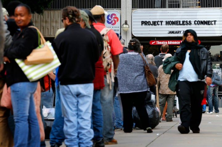 Homeless families and individuals line up to attend Project Homeless Connect in San Diego in 2015, a one-day resource fair. Local officials are trying to find ways to address an outbreak of hepatitis A.