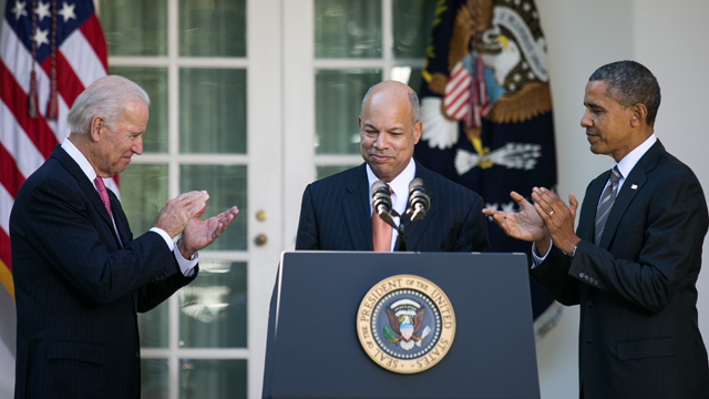 <p>Then-U.S. Homeland Security Secretary, Jeh Johnson ‘79, being applauded by President Obama H‘13 and Vice-President Biden.</p>