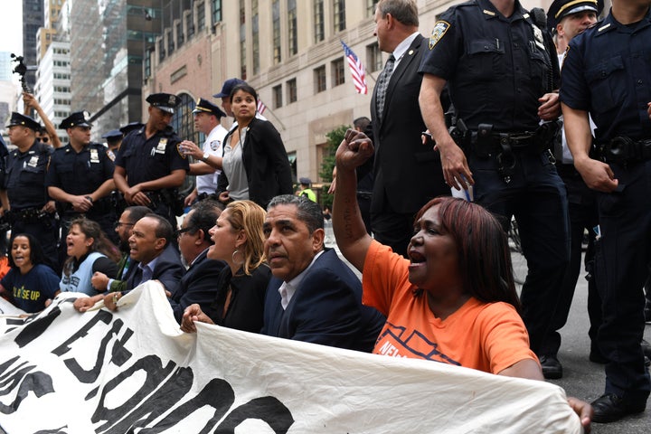 Activists sit on Fifth Avenue blocking traffic alongside Rep. Adriano Espaillat (D-N.Y.), Speaker of the New York City Council Melissa Mark-Viverito (D), Reps. Raúl Grijalva (D-Ariz.) and Luis Gutiérrez (D-Ill.) before getting arrested, during a rally to demand that President Donald Trump work with Congress to pass a clean Dream Act.