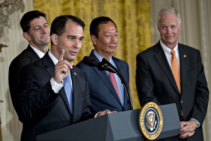 Scott Walker, governor of Wisconsin, speaks as Senator Ron Johnson, billionaire Terry Gou, chairman of Foxconn Technology Group, and U.S. House Speaker Paul Ryan listen during an event in the East Room of the White House, July 26, 2017.