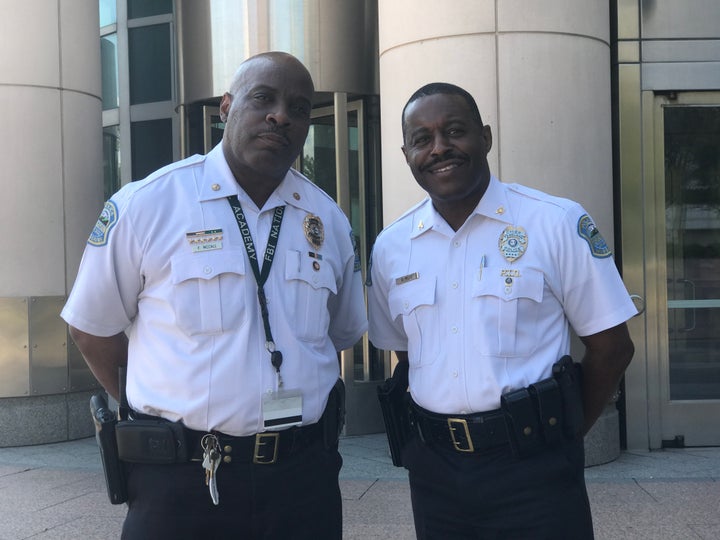 Ferguson Police Commander Frank McCall and Ferguson Police Chief Delrish Moss at the federal courthouse in St. Louis on