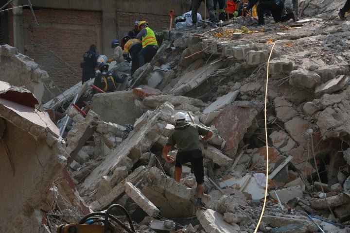 People clear rubble in Mexico City in the wake of the 7.1 magnitude temblor 