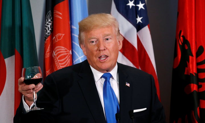 Teetotal Trump toasts during a luncheon yesterday.