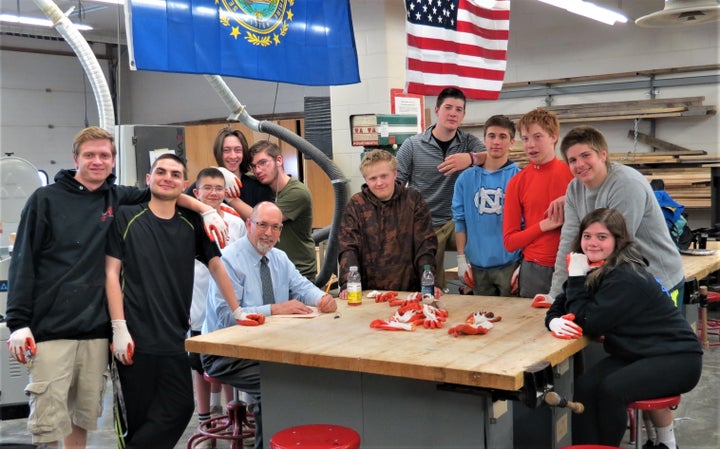 <p>Students involved with recycling program sit with Dennis Perrault, Social Studies teacher and founding father of C.R.A.P</p>