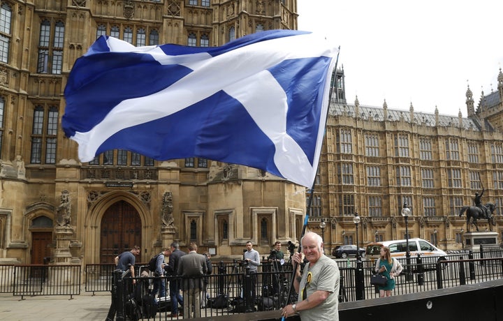 An SNP supporter outside Westminster.