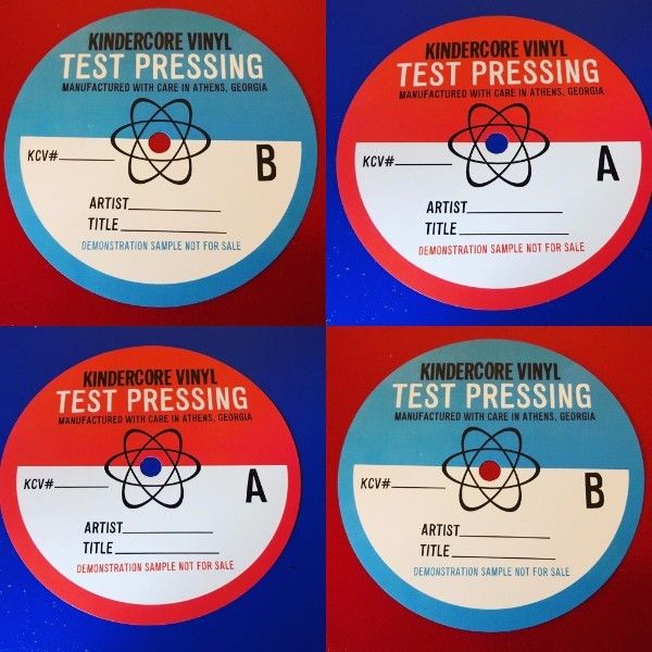 <p>Kindercore's test pressing labels </p>