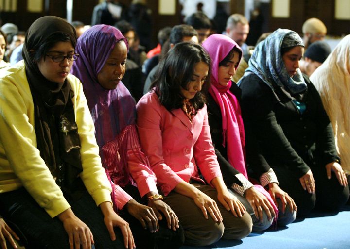 A group of women pray at the end of a public mixed-gender Muslim prayer service that was held in New York City, March 18, 2005. 