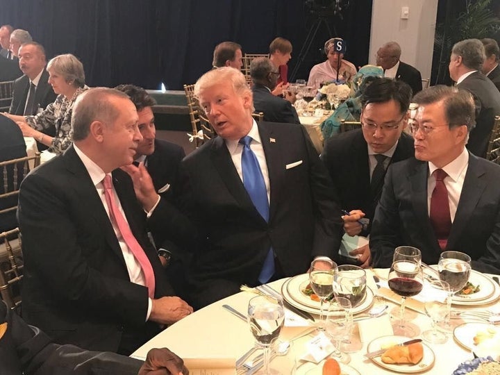 President of Turkey Recep Tayyip Erdogan L and US President Donald Trump 2 L chat each other during a dinner hosted by United