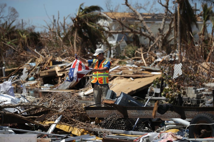 Rescue volunteer Sam Kichline from What's Next Adventures searches for people in a waterfront neighborhood hard hit by Hurricane Irma on Sept. 15 in Marathon, Florida.