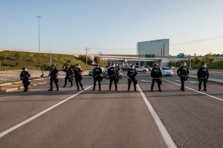 Riot police block Brentwood Boulevard by the St. Louis Galleria in Clayton, Missouri, as protesters attempt to march down the road Wednesday.
