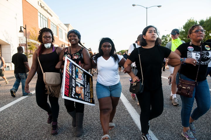 Protesters attempt to retake ground on Brentwood Boulevard in St. Louis after flanking the police line to find a route to the