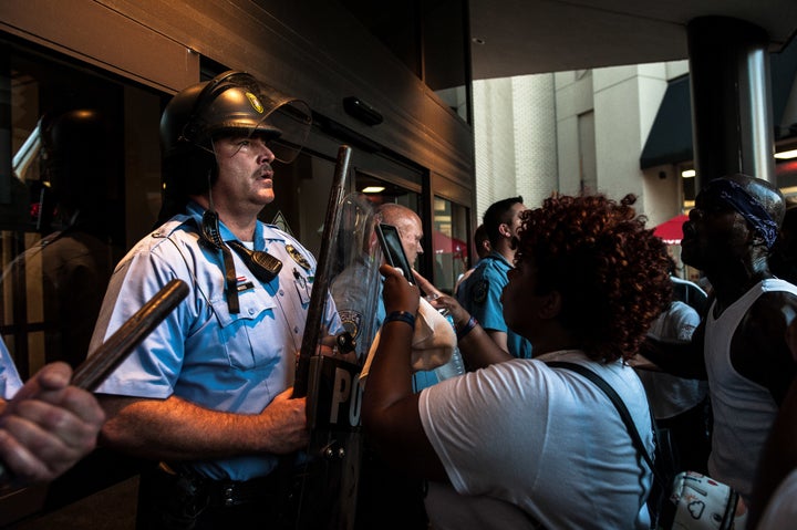 Riot police guard the entrance to the St. Louis Galleria, where protesters gathered on Wednesday.