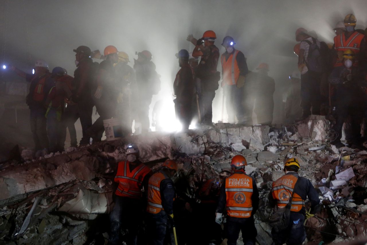 Rescuer workers desperately searched for survivors overnight 
