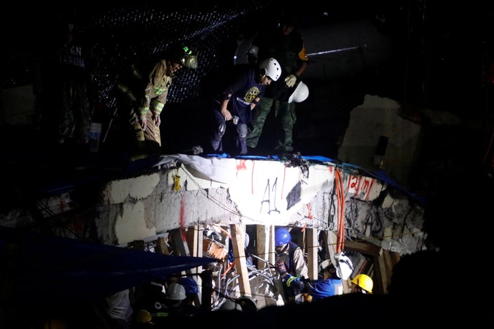 Rescue workers search through the rubble for students at Enrique Rebsamen school after an earthquake in Mexico City, Mexico.