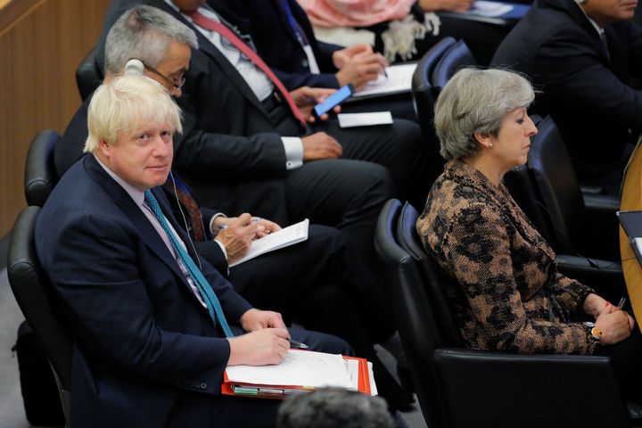 Theresa May sits in front Johnson during a meeting to discuss the current situation in Libya during the 72nd United Nations General Assembly at U.N. headquarters.