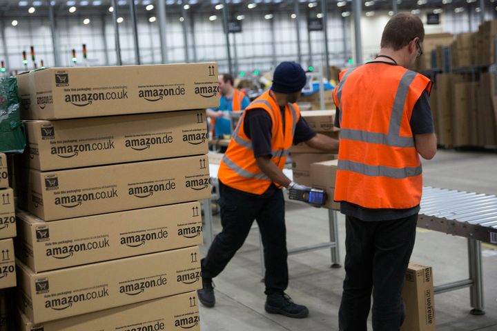 Staff at Amazon in Rugeley load boxes and packages, pictured in 2013