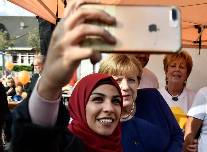 A Syrian refugee poses for a selfie with Angela Merkel during a campaign stop a week before the election.