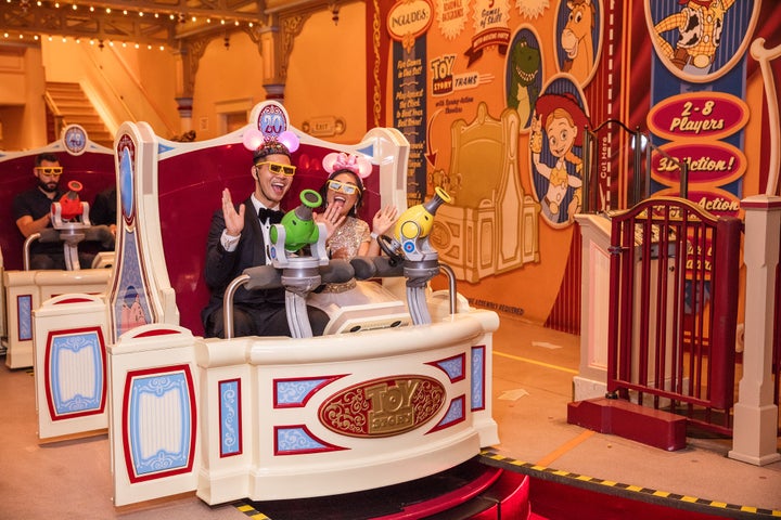 After the reception, the newlyweds enjoyed the Toy Story Mania ride.