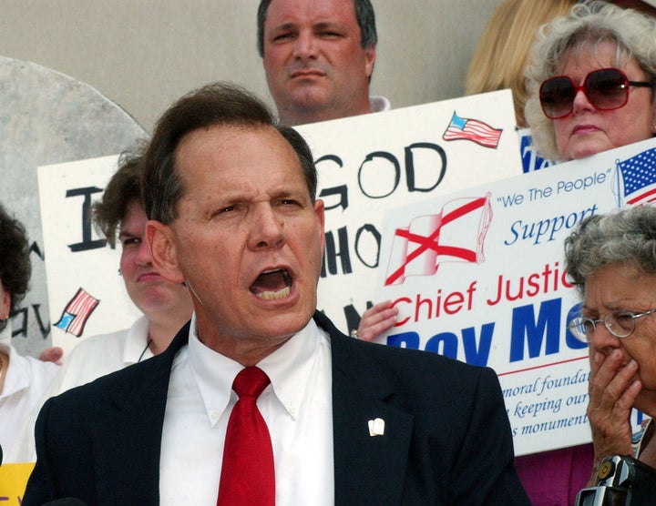 Then-Alabama chief justice Roy Moore speaks outside the state judicial building in Montgomery on Aug. 25, 2003.