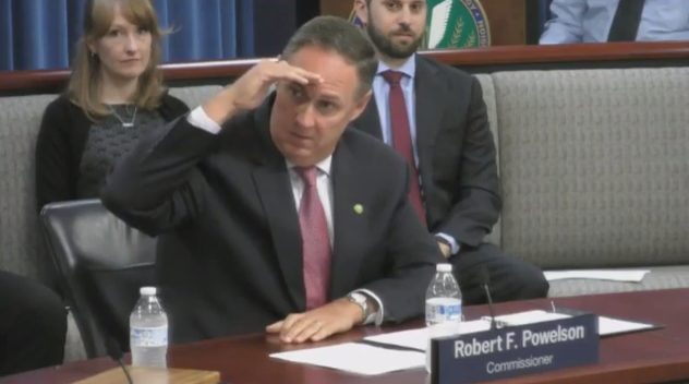 Commissioner Robert Powelson salutes colleague Cheryl LaFleur.