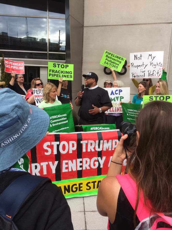 Reverend Lennox Yearwood of the Hip Hop Caucus addresses the protesters.