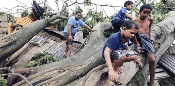 Children from Loíza, Puerto Rico in their devastated neighborhood after Hurricane Irma. 